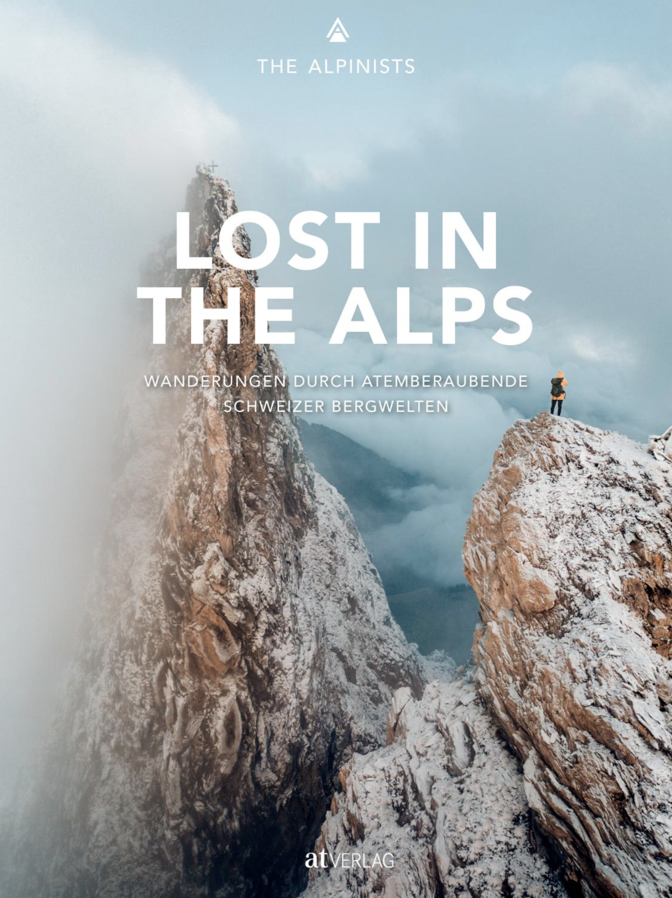 Poster of a climber standing on a snowy alpine ridge with dramatic clouds; large title 'LOST IN THE ALPS' overlays the image.